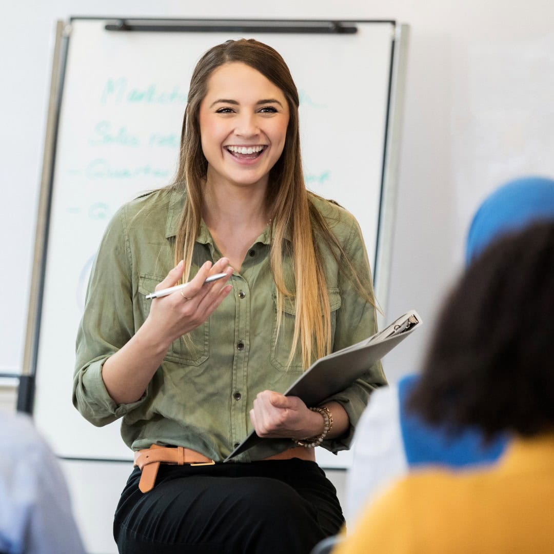 Innovative business coaching session with a smiling female consultant at Charlotte Wilding Consulting.